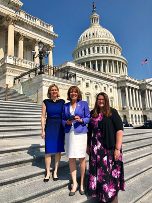 Lisa Sherman, Representative Susan Davis, and Jessica Reed with their Democracy Award at the U.S. Capitol Building